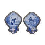 A pair of French fayence and clear-glass blue and white wall sconces