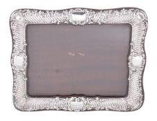 An Edwardian silver photograph frame by Samuel M Levi