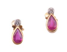 A pair of ruby and diamond ear studs