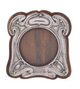 An Arts and Crafts silver small photograph frame