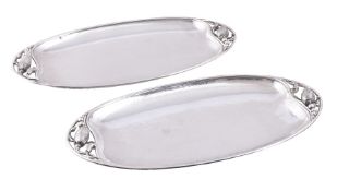 Georg Jensen, a pair of Danish silver Blossom pattern trays