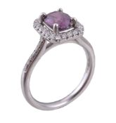 A purple sapphire and diamond cluster ring