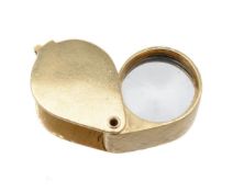 An 18 carat gold jewellers loupe