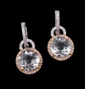 A pair of diamond and zircon ear pendants