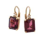 A pair of garnet and diamond earrings