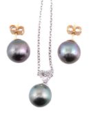 An 18 carat gold diamond and Tahitian cultured pearl pendant