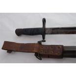 Remington U.S. bayonet marked 1913 with leather scabbard