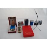 A collection of vintage lighters including The K.K.W. Camera Lighter