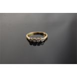 An 18ct Gold Ring Set 4 Diamonds