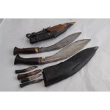 Two 20th C. Ghurka Kukri Knives in Leather Scabbards, one with three smaller knives