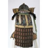 A 32 plate Suji Kabuto, Japanese Edo period with steel and silk embroidered body armour