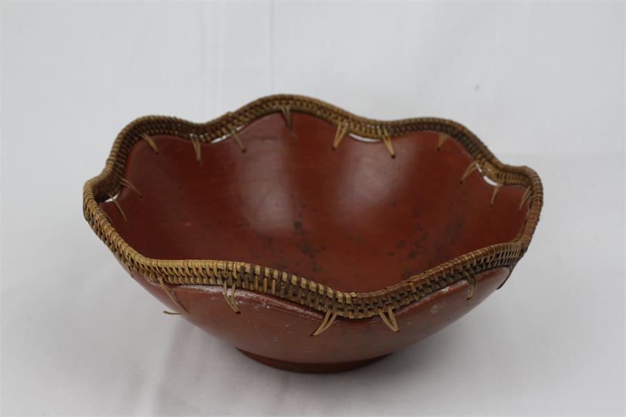 A Wicker-bound Continental Pottery Bowl