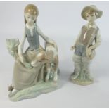 Lladro Figure of a girl with a calf 20cm high and another Lladro figure of boy fisherman