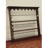 18th century oak delft rack, dentil cornice above stepped arched frieze, three tiers,