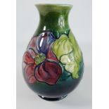 Moorcroft baluster Vase decorated with the Clematis pattern on a shaded green and blue ground,