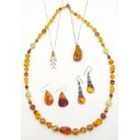 Amber bead Necklace with gilt metal spacers, amber pendant with inclusions,