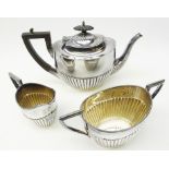 Silver plated three piece oval tea set and a canteen of plated cutlery in an oak box