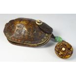 Chinese tortoiseshell leather and ivory pouch with a Kagamibuta Netsuke carved as a bird in a nest
