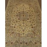 Fine Persian Kashan ivory ground carpet, overall floral design with stylised flower heads,