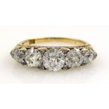 18ct Gold Ring set with five graduated old cut diamonds interspersed with small diamond spacers