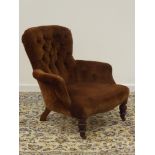 Victorian walnut framed armchair upholstered in deeply buttoned fabric, turned feet,