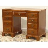 Edwardian walnut dressing table/desk, nine drawers, on bracket feet, W119cm, H81cm,