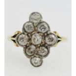 18ct gold Ring with a cluster of nine diamonds in a lozenge shape setting.