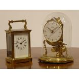 Carriage Timepiece with white dial in brass and bevelled glass case,