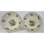 Pair of Berlin porcelain Plates each painted with birds on flowering branches on an Ozier pattern