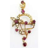 15ct gold Pendant of scroll and floral design set with nine rubies and graduated seed pearls.