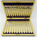 Set of twelve fish knives and forks with engraved plated blades in mahogany case