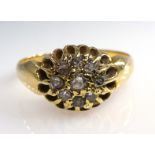 18ct Gold Dress Ring set with a cluster of nine diamonds within a pierced surround