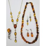 Amber bead Necklace, silvered metal brooch inset with an amber panel ,