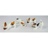 Series of four Royal Doulton Character dogs in various poses.