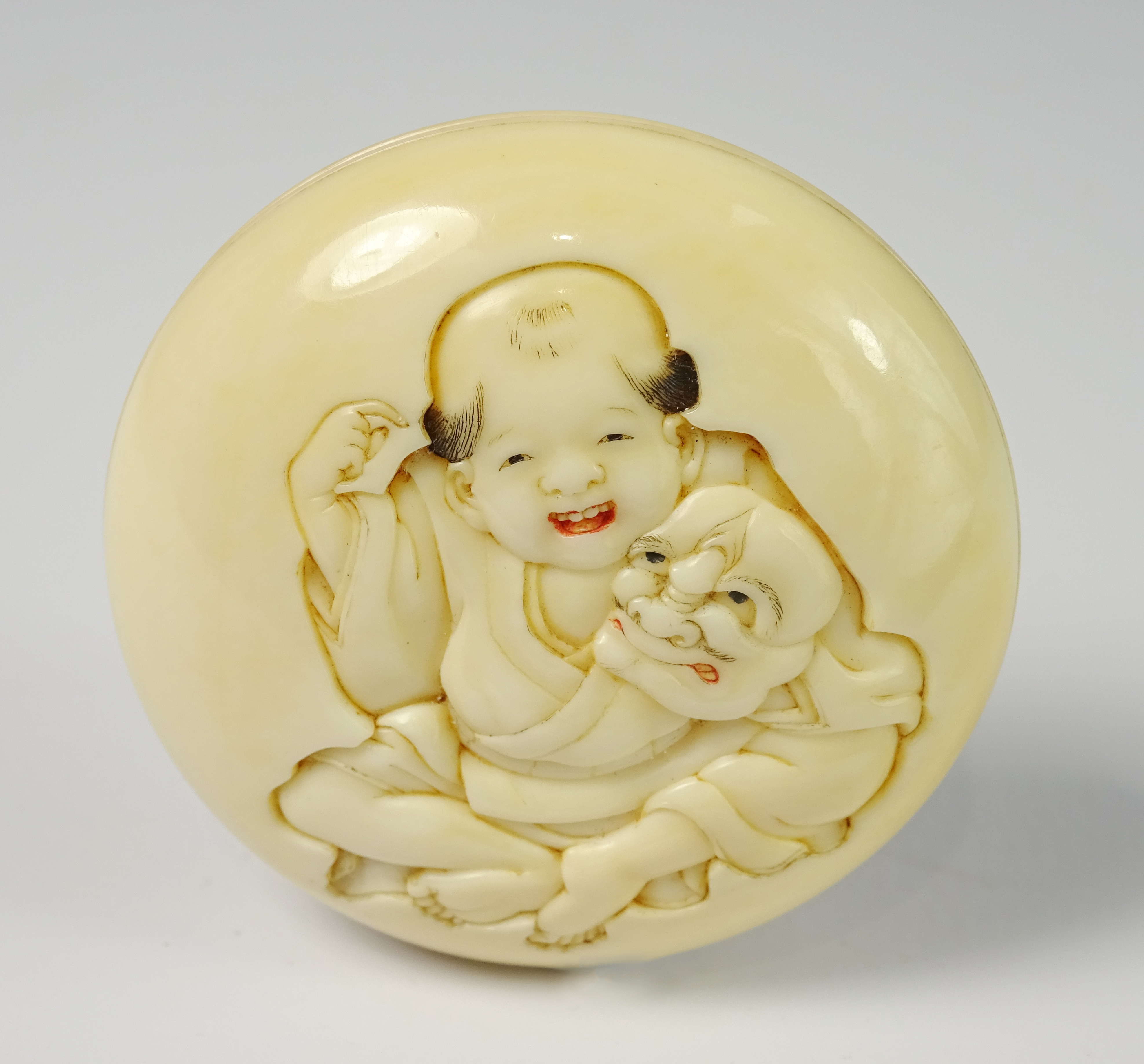 19th Century Japanese Manju ivory Netsuke carved with a figure and with signature to the reverse
