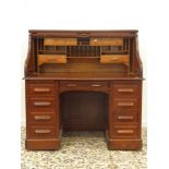 Oak Roll Top Desk enclosed by a tambour shutter with fitted interior and drawers under,