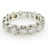 Eternity Ring set with fifteen brilliant cut diamonds, each approximately 1/4 of a carat,