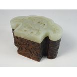 19th / 20th Century Chinese hardwood box with a pale celadon jade Ruyi-form cover carved with a