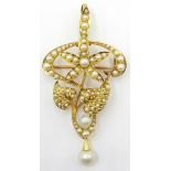 15ct Gold Pendant of scroll flower head and leaf design set with graduated seed pearls and hinged