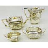 Edwardian silver four piece tea set with engraved decoration, pierced border and ball feet,