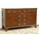 18th century oak dresser base, six drawers and two cupboards, front inlaid with checkered banding,