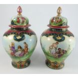 Pair of Vienna baluster Vases and covers printed with cherubs and other figures within a blue red