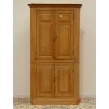 Large late 19th century pine corner cupboard, projecting cornice above four panelled doors, W115cm,