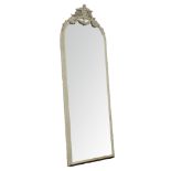 Large late 19th century mirror, oval cartouche pediment with scroll foliage and floral swags,