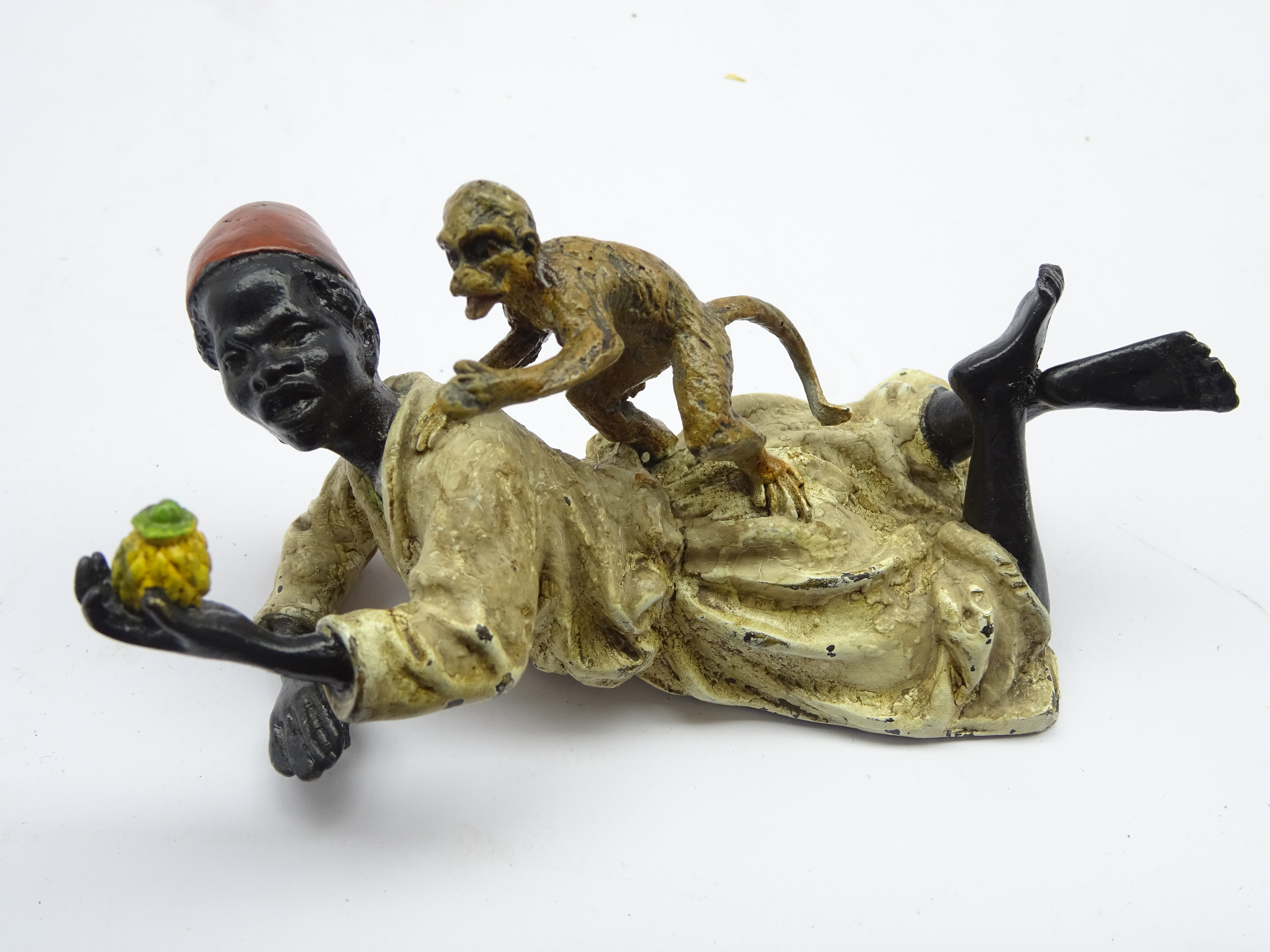 After Bergmann, Austrian cold painted bronze of a boy feeding monkey, impressed Geschütz, L10.