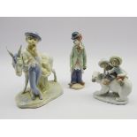 Three Lladro figures 'Eskimo Riders', 'Circus Sam' & a boy with Donkey,