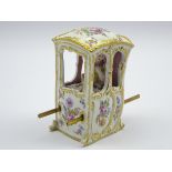 Late 19th century Dresden porcelain figure of a lady in a Sedan chair with polychrome painted