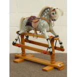 20th century Dapple Grey painted rocking horse, on beech trestle base, with 'Triang' label,