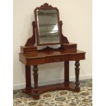 Victorian mahogany Duchess dressing table, bevelled swing mirror with carved supports,