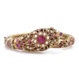 Victorian style Indian ruby and seed pearl hinged bangle in the form of a cobra Condition